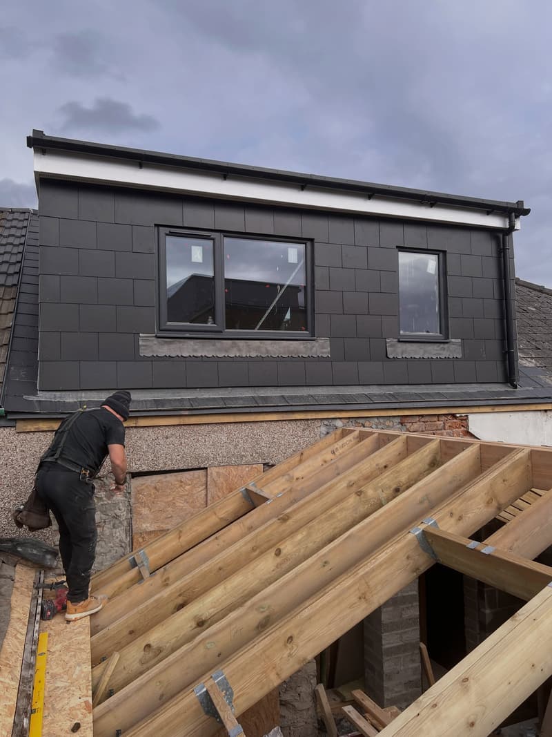 New dormer under construction above timber floor joists at the Cathays four-flat development