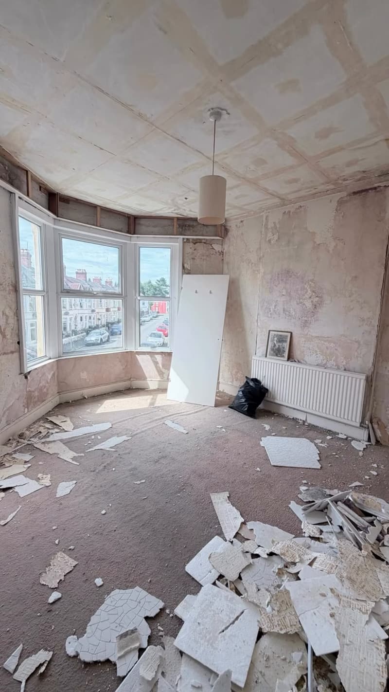 Front room with bay window mid strip-out