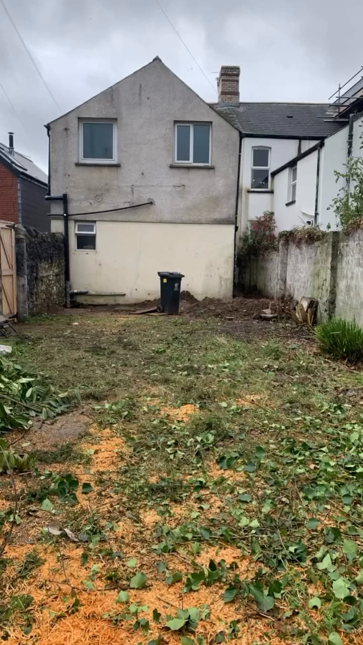 The rear garden before work: rough ground in front of the original rear wall