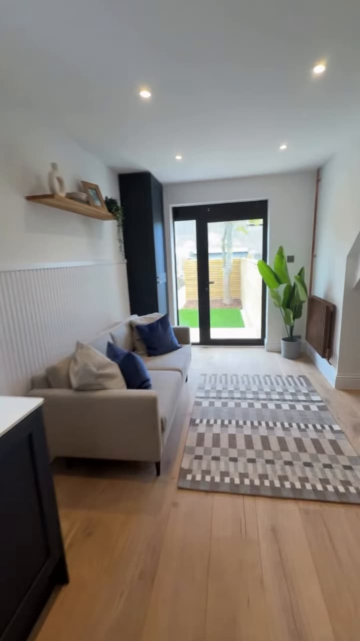 Living area with glazed doors opening to the garden