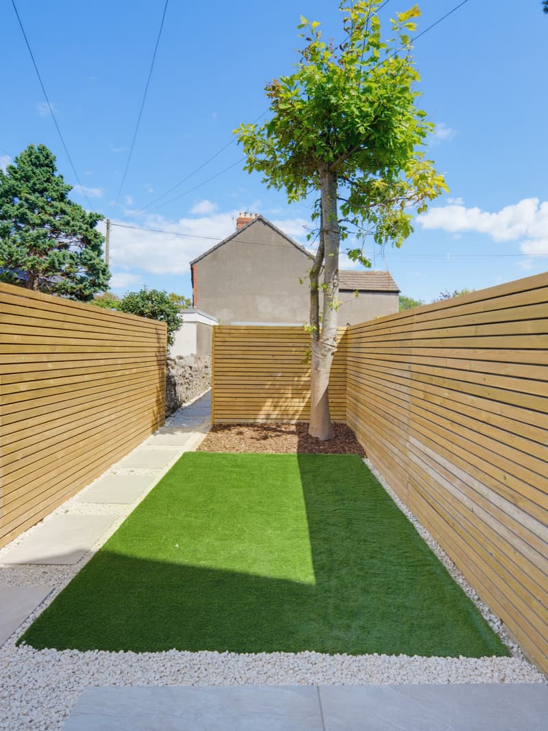 Rear garden with new lawn, path and horizontal timber fencing