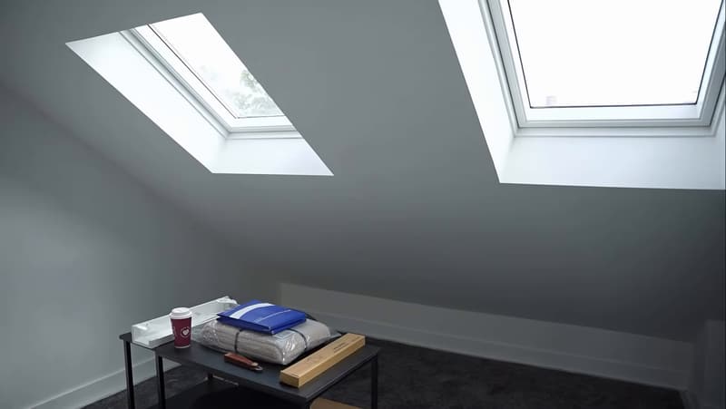 Top-floor bedroom with twin skylights before the HMO is dressed