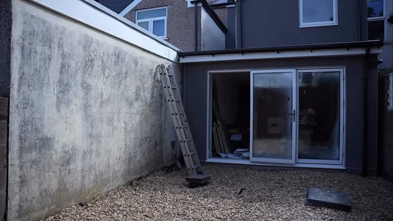 Rear elevation with sliding doors from the open-plan kitchen